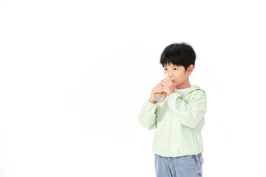 Young Boy Drinking Water from Bottle