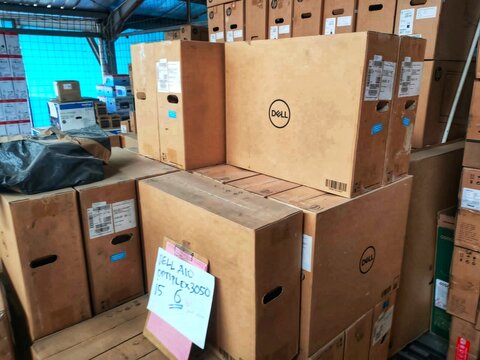 Cimahi, INDONESIA, 20 April 2022 - Stacked cardboard Dell computer boxes ideal for illustrating warehouse storage, industrial shipping, inventory management, logistics, and supply chain concepts.
