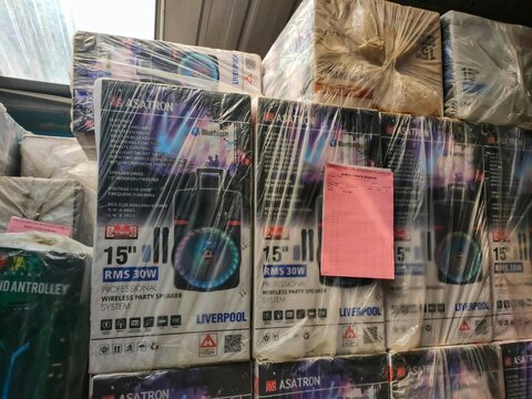 Cimahi, INDONESIA, 20 April 2022 - Plastic wrapped speaker boxes stacked in warehouse for storage, suitable for music retail and logistics industries marketing materials.