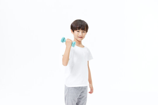 Young Boy Holding Dumbbell for Exercise