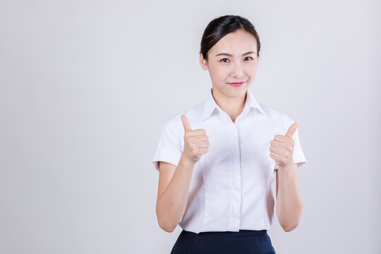 Smiling Businesswoman Giving Thumbs Up
