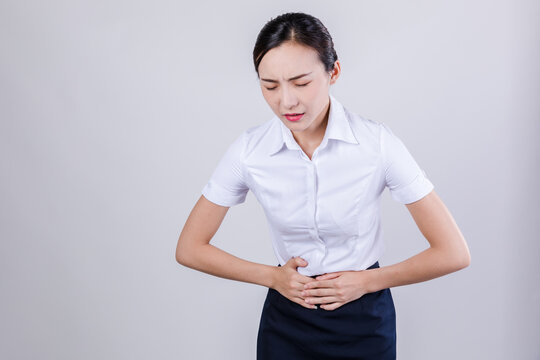 Distressed Woman Clutching Stomach in Pain
