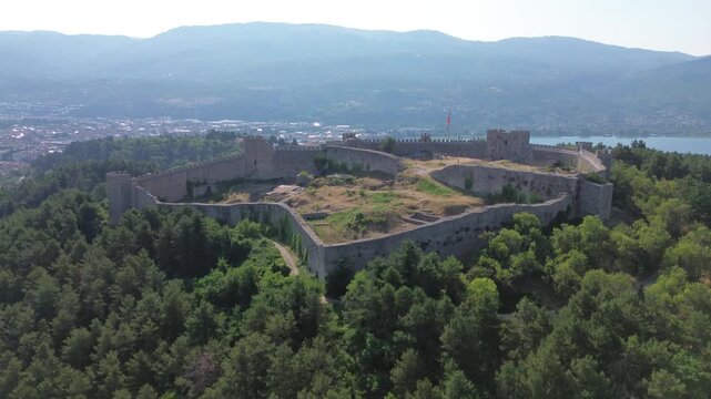 Panoramic aerial view of Samuel Fortress walls surrounded by forest, Ohrid, North Macedonia