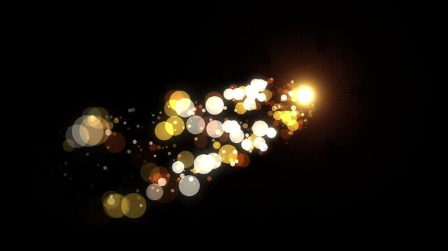 Abstract golden light particles trail on black background
