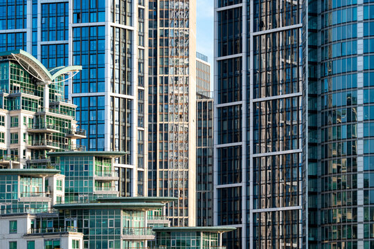 High rise buildings in London with layered glass towers and dense urban architecture creating a complex city view of modern development and vertical design