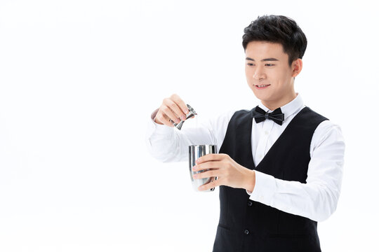 Bartender pouring cocktail at white background