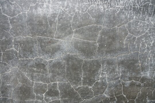 ​Close up background texture of cracked polished concrete wall surface