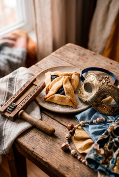 Purim Holiday Celebration with Hamantaschen, Festive Mask and Gragger