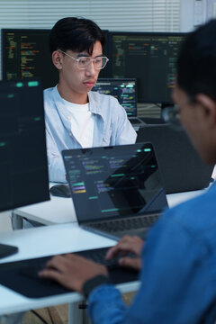 Programmers Collaborating on Digital Code and AI Development