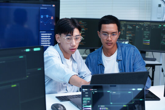 Programmers Collaborating on AI Software Development