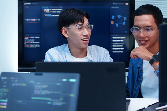 Programmer and Developer Collaborating on Digital AI Project