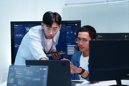 Programmers Collaborating on Digital Code and AI Development