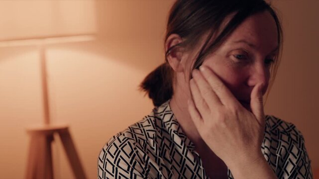 Close-up portrait of worried anxious woman speaking during conversation, emotional communication and concern concept, 4K