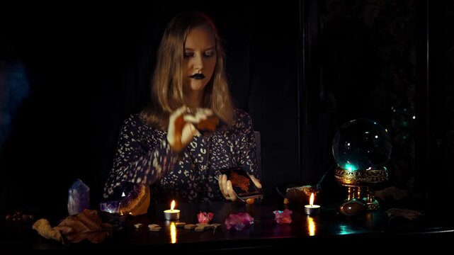 Enchanting Halloween: A Mysterious Witch's Rituals Under Candlelight with Crystals and Spooky Decor