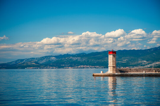 Lighthouse On Adriatic Coast With Mountain Horizon