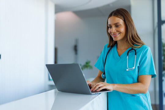 Medical professional using laptop for healthcare management