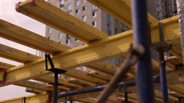 Timber formwork beams supporting concrete floor construction