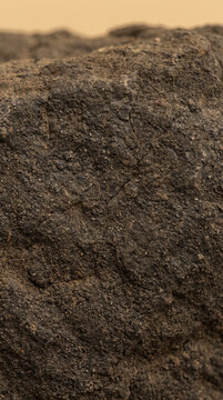 Venusian volcanic rock texture with brown soil landscape