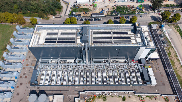 Aerial view of the Equinix Data Center featuring extensive rooftop cooling infrastructure and industrial equipment in Castelletto, Lombardia, Italy.