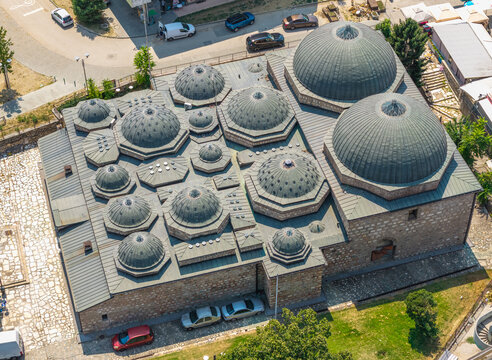 Aerial view of the historic Daut Pasha Hamam in the Old Bazaar, featuring its distinctive multiple domes and stone architecture in Skopje, Greater Skopje, North Macedonia.