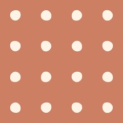 Simple polka dot pattern with a warm terracotta background and cream circles © Syaima Levantine