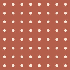 Seamless pattern of beige polka dots on a warm terracotta background © Syaima Levantine