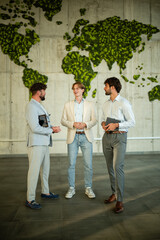 Fototapeta premium Business men discussing global strategy in modern office