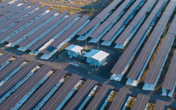 Aerial view of PLTS Medco Solar Bali Timur with rows of solar panels and a central power station in Kubu, Bali, Indonesia.