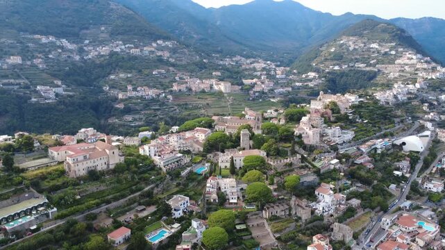 Aerial wide orbit view of Ravello town and surrounding coastal mountains 4K