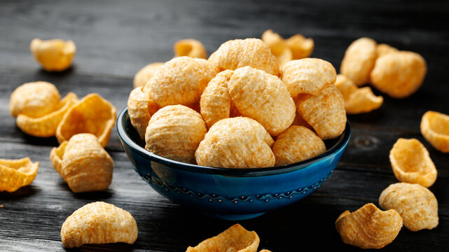 Hummus Chips Served in a Blue Bowl on Dark Wooden Table