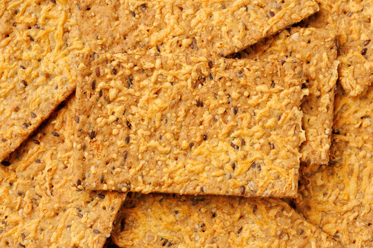 Wholegrain Cheese Crispbread with Mixed Seeds on Dark Background