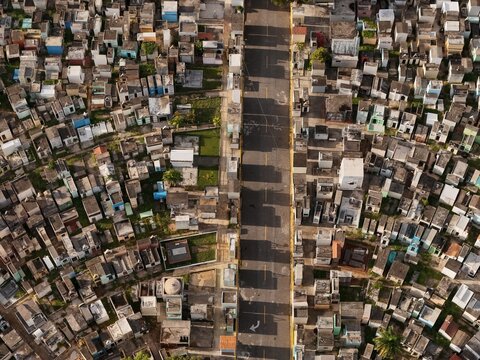 Aerial view of Maximo Gomez National Cemetery with its dense grid of mausoleums and tombs separated by a central road in Santo Domingo, Distrito Nacional, Dominican Republic.