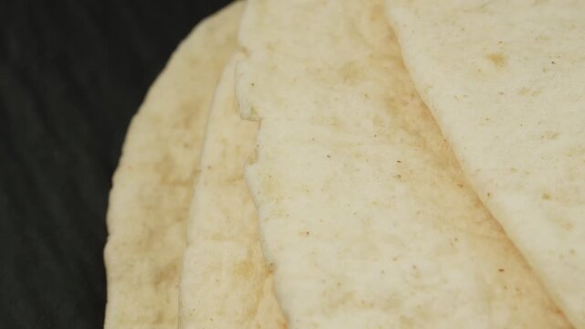 Tortilla flat bread macro close up presentation slowly rotating stock footage