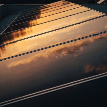 Opened ingClose-up of a modern sleek solar panel reflecting a warm golden sunset, clean renewable energy integration, sustainable ESG conceptredient