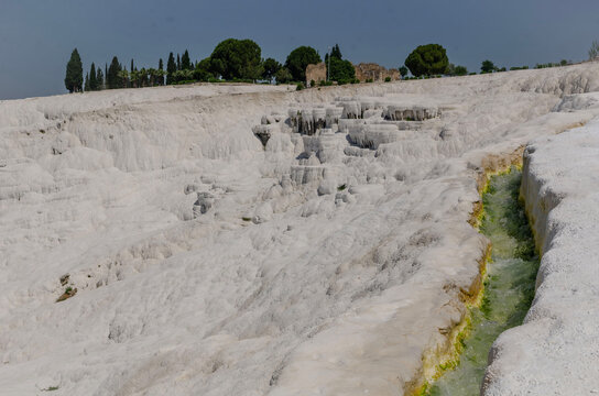 Pamukkale Turkey travertine terraces white mineral formations thermal springs ancient landscape blue sky natural wonder tourism destination geology calcium pools
