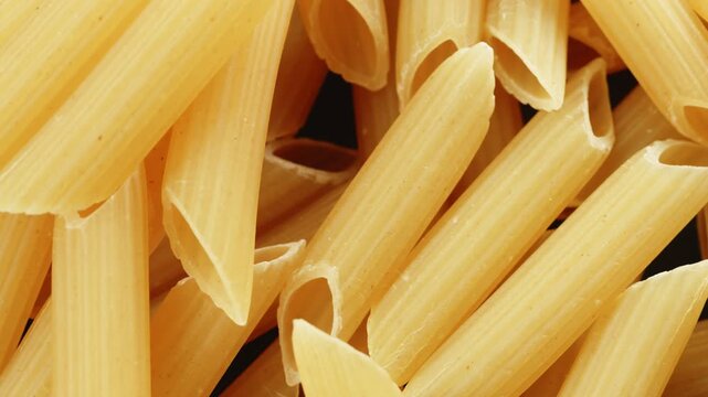 Penne pasta tubes macro close up presentation slowly rotating stock footage