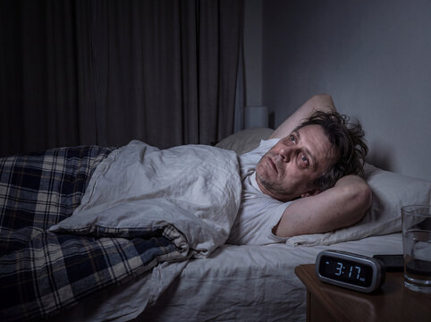 Man Suffering From Insomnia and Sleepless Night