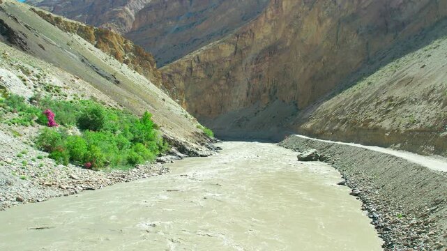 Aerial view of the deep Zanskar Gorge with its winding river and steep rocky cliffs in Zanskar, Ladakh, India.