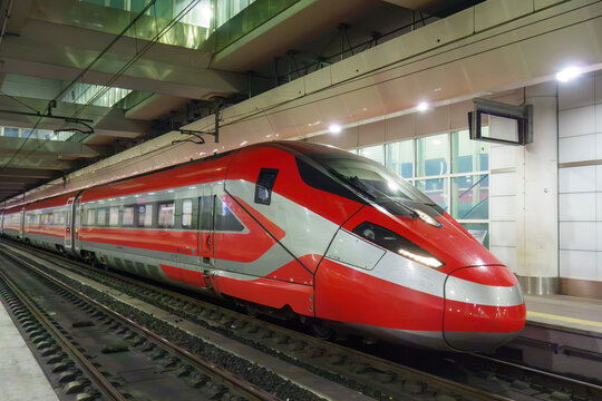 Modern High-Speed Train at Railway Station Platform. Aerodynamic Locomotive Design, Urban Transport, Public Commuting and Travel Concept.