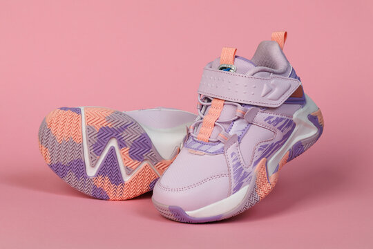 Kids Pink Sneakers on Pink Background. Colorful Children's Sportswear