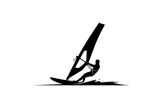 Silhouette of windsurfer on calm water.
