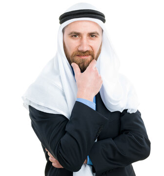Thoughtful Arab businessman wearing keffiyeh with hand on chin looking at camera isolated on white background.