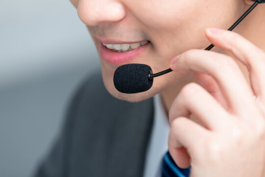 Close Up of Smiling Customer Service Representative with Headset