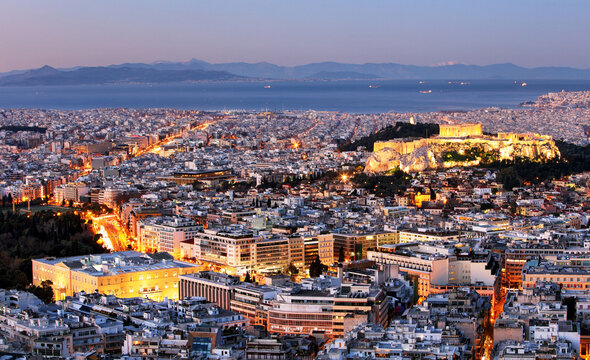 Athens skyline panorama with Acropolis in Greece from peak Lycabettus at night