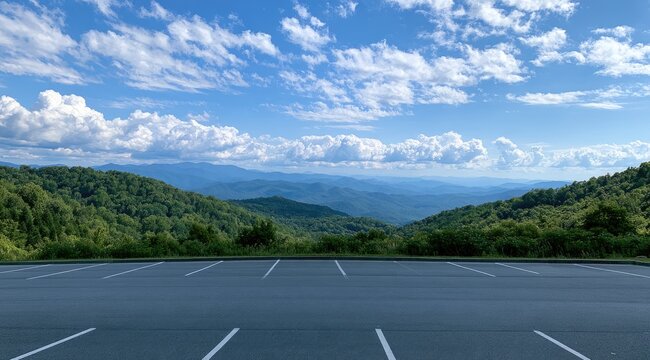 Expansive vista of rolling green mountains under a vast, cloud-dotted blue sky