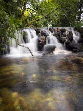 Scenic forest waterfall long exposure view in Ancora