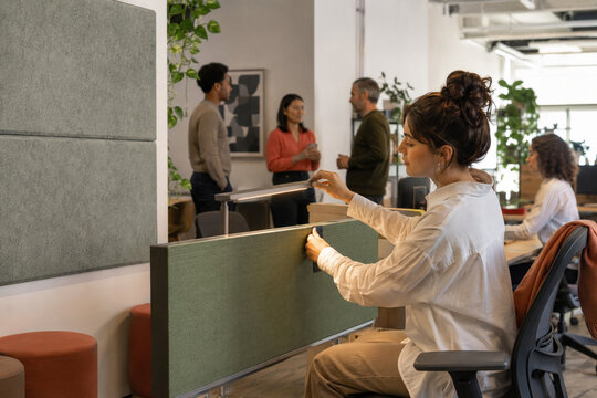 Employee Adjusting Low Stimulation Focus Zone at Work