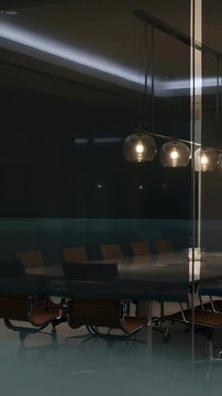 Vertical video: Lowering motorized shade in office, oval table and pendants softening glow
