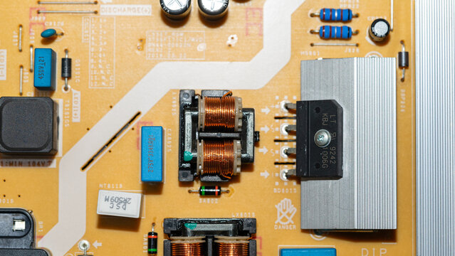 Bridge rectifier attached to aluminum heat sink on power supply board