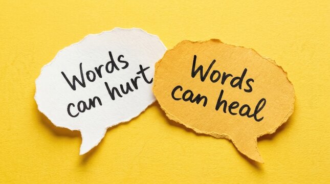 Two paper speech bubbles displaying contrasting messages regarding the powerful impact of language and communication written in black ink script lettering